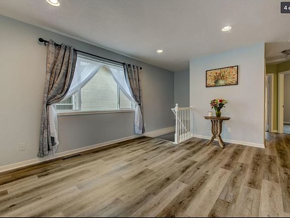 Main floor living room access to stairs