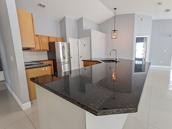 Kitchen with granite countertops.