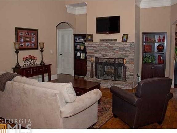Family/Living area is spacious, tons of natural lighting, quaint and cozy stone fireplace.
