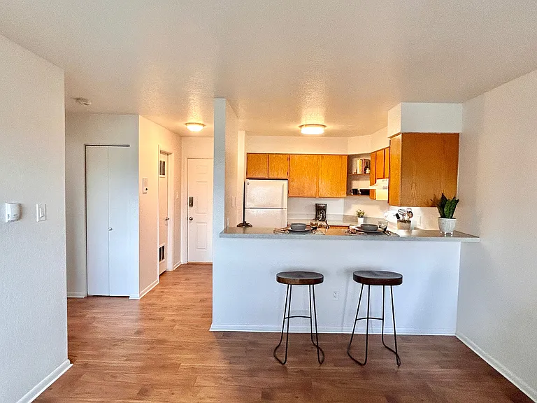 Experience modern living with this stylish apartment featuring a cozy kitchen setup. Experience modern living with this stylish apartment featuring a cozy kitchen setup.