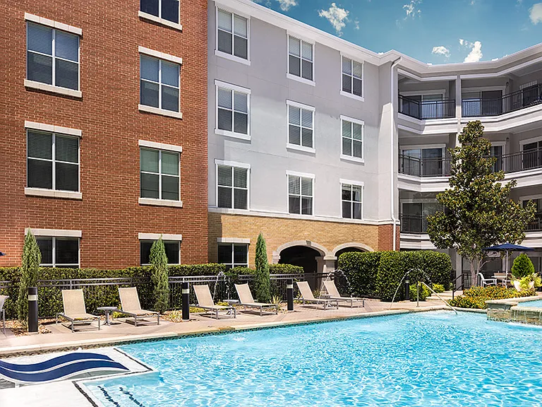 Residents enjoy two resort-style swimming pools with sun shelves