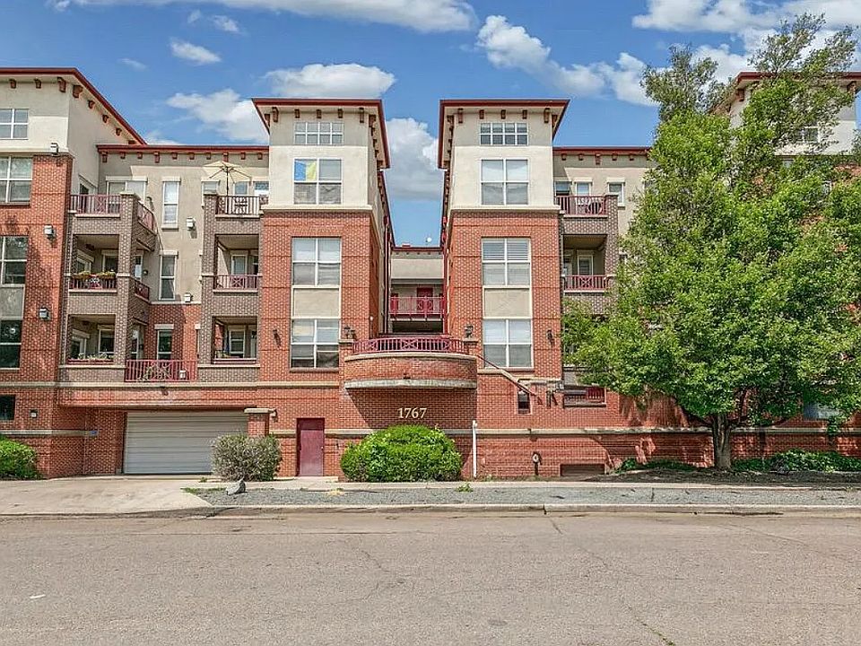 Secure, modern condominium complex with commercial security, garage parking, and nearby entertainment.