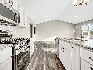 Very Nice Slate Colored Kitchen Appliances.