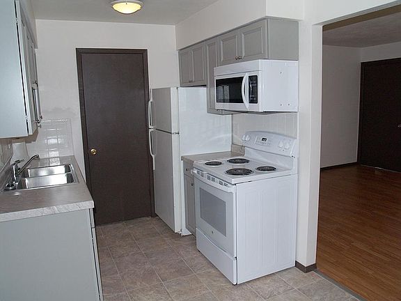 Refrigerator, stove and built in microwave included.