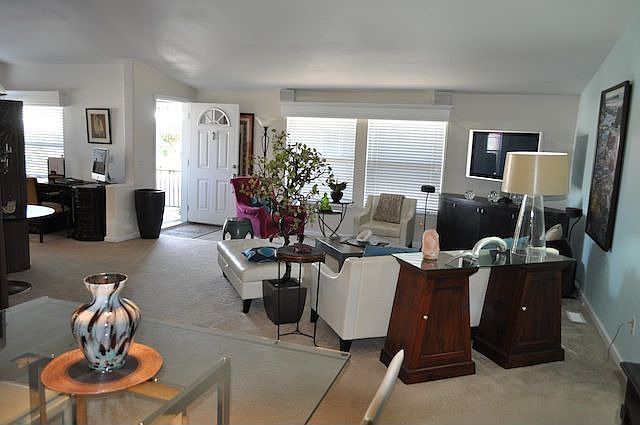 spacious and open living room, dining room and office