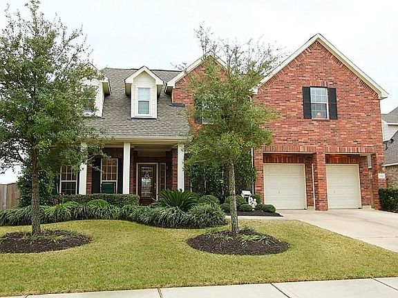 Stunning brick elevation with immaculate landscaping and curb appeal.
