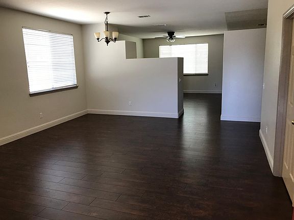 Enter to the Great room (Living & Dining). Beyond is the family room and kitchen. Bedroom 4 is thru the door partially shown on the right.