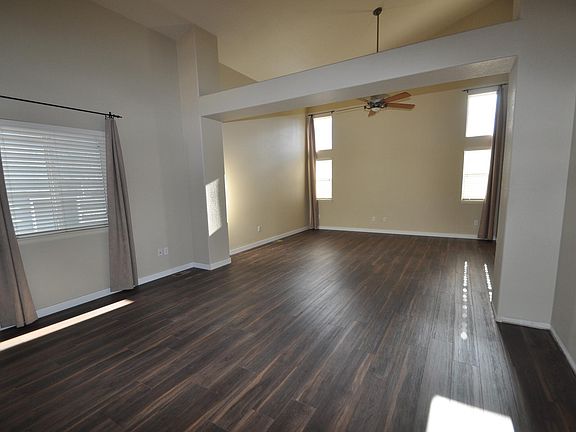Main-level living room with newer vinyl plank flooring