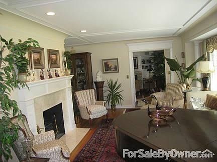 Living room
						:
						cove ceilings, mouldings, marble faced fireplace.