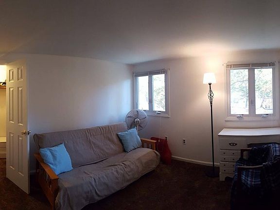 Top floor bedroom facing backyard of building