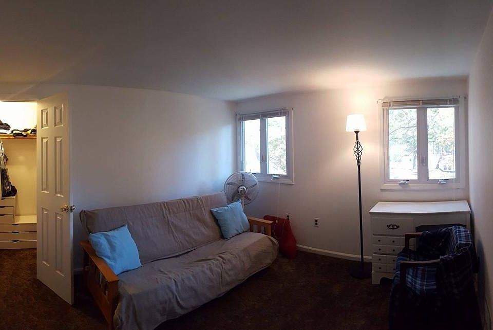 Top floor bedroom facing backyard of building