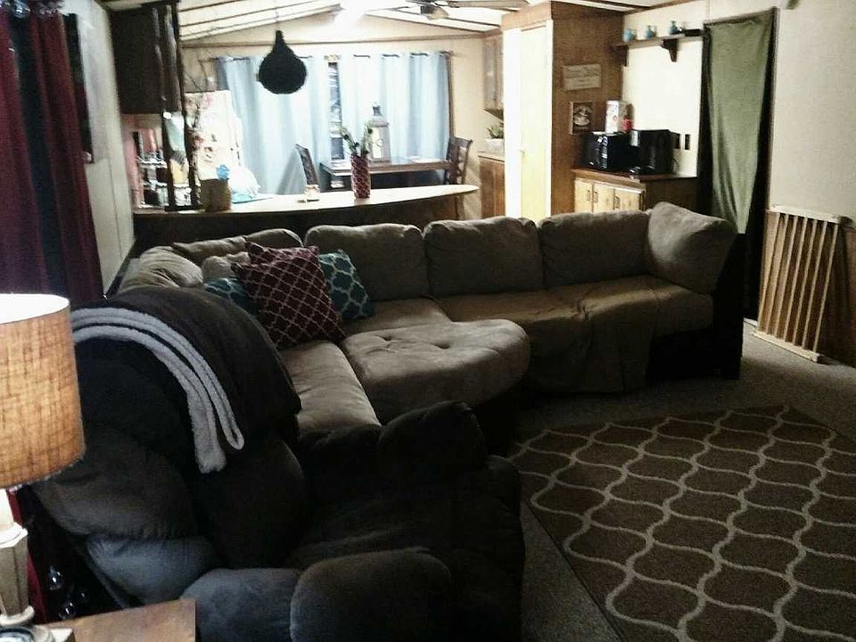 looking from hallway thru to living room and kitchen