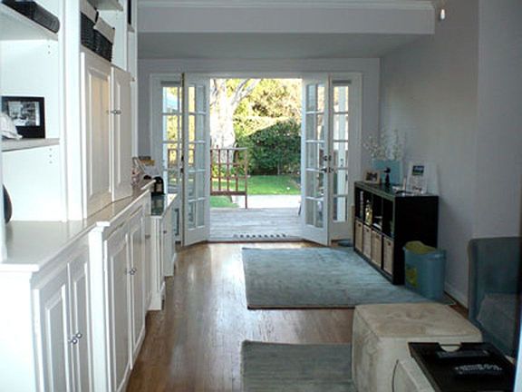 Den Leading to Backyard Through French Doors