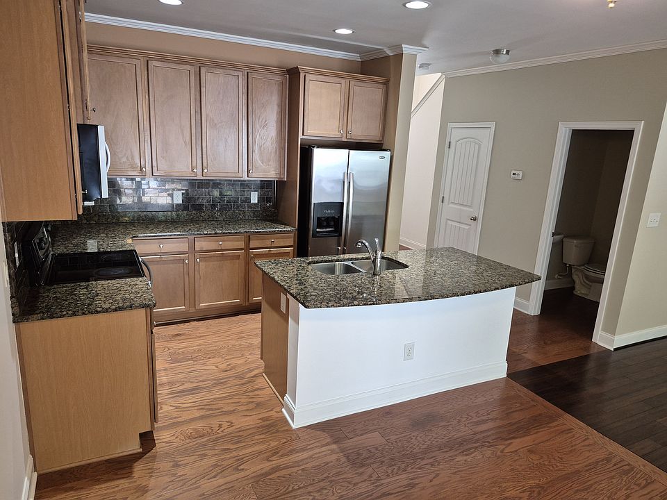 Kitchen from dining area. 1/2 bath located off kitchen area