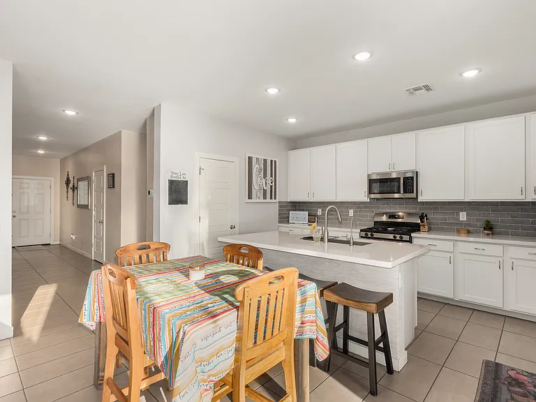 Kitchen and dining area. Plenty of cupboard space.