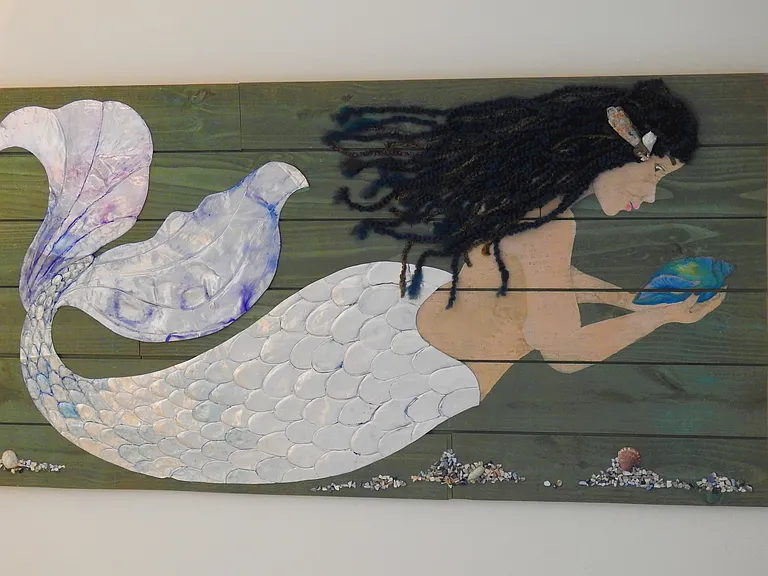 Original mermaid artwork in guest room makes for memorable visit.