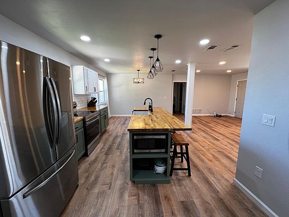 Kitchen island with microwave and two additional outlets