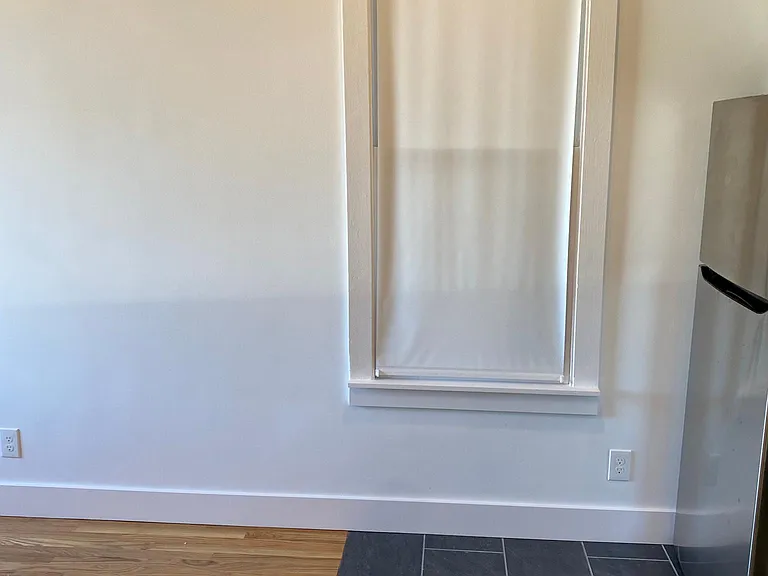 COZY DINING AREA ADJACENT TO KITCHEN