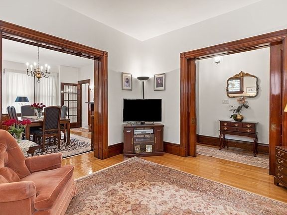 main living room, passage to entryway and dining room