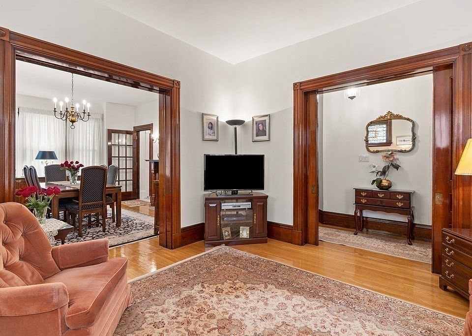 main living room, passage to entryway and dining room