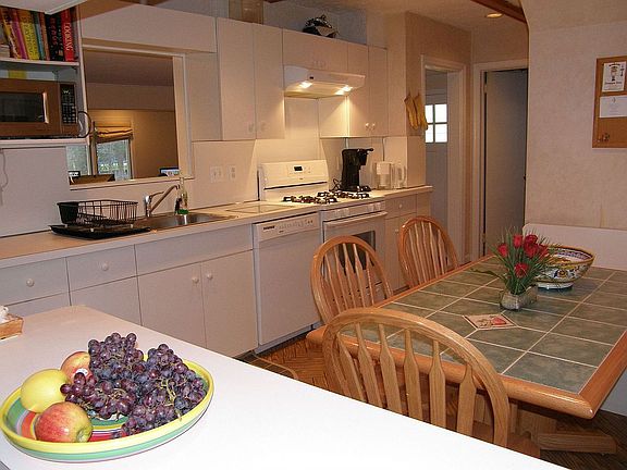 This view shows the built-in banquette and the opening to the dining room 
