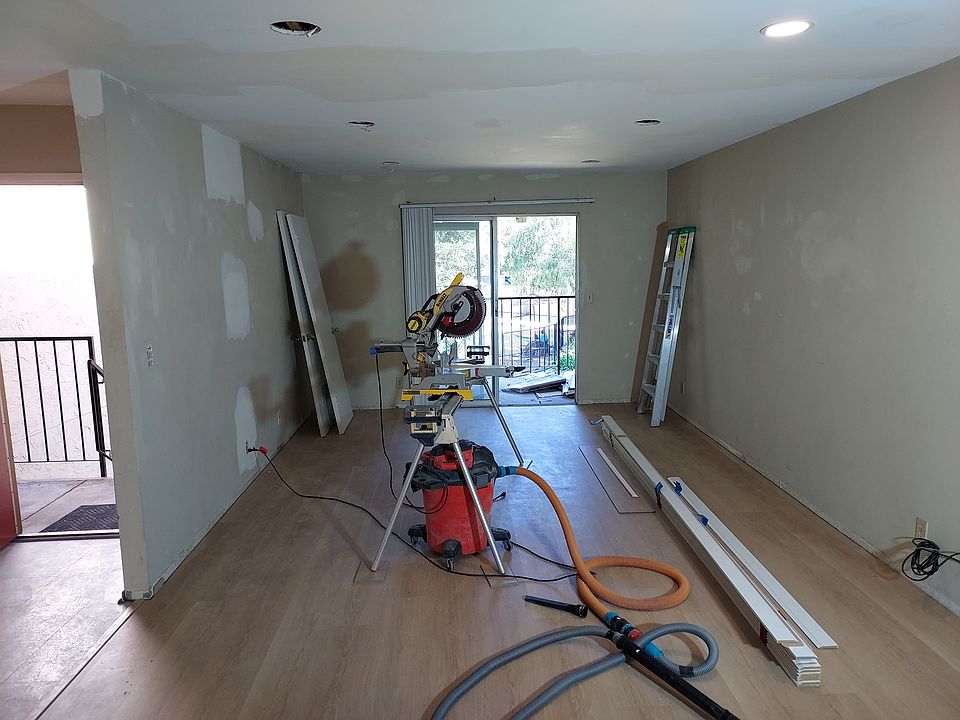 New floor installed and recessed lights. Baseboards and painting next.
