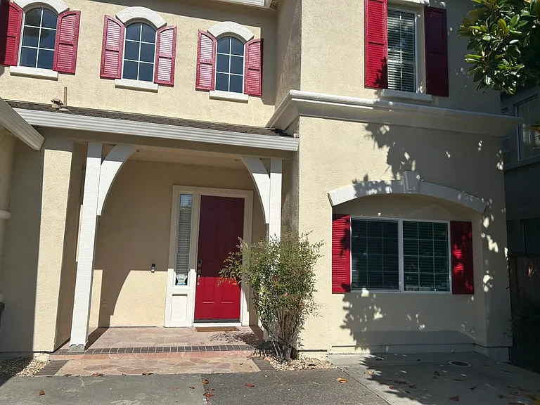 Front of the house, facing east, freshly painted exteriors