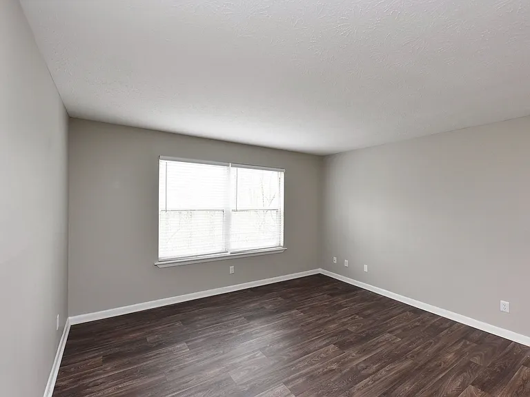 Spacious living room with hardwood-style flooring