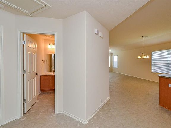 The secondary bath is spacious. Notice the kitchen on your r