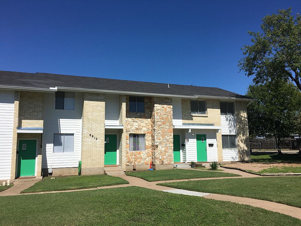 Front of fourplex.#104 is the far right with a nice side yard.