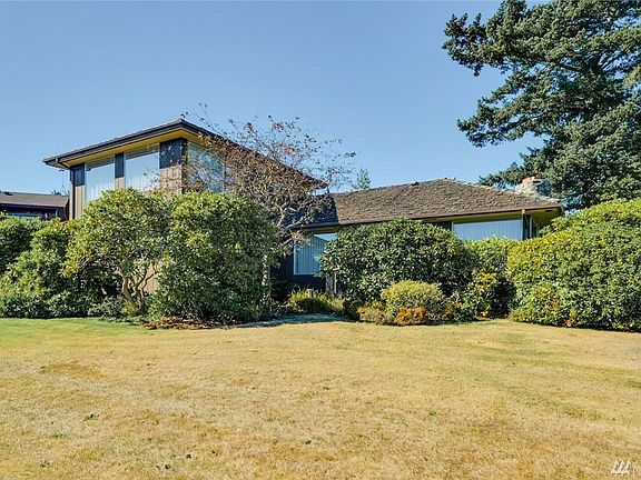 Large yard with mature landscaping.