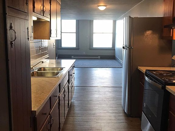 Galley kitchen includes an abundance of cabinet storage and work space.