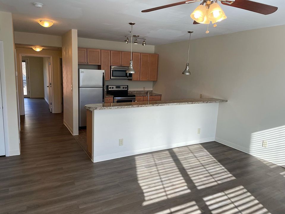you enter into this open kitchen area with the sun shining through
