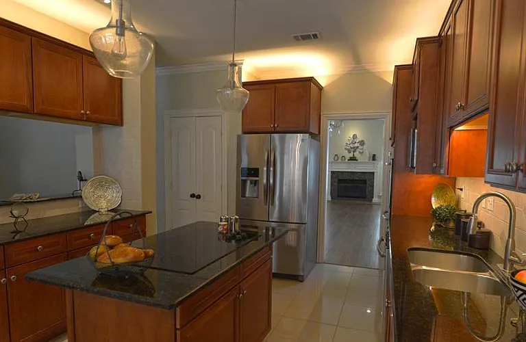 Beautiful open kitchen with above cabinet lighting