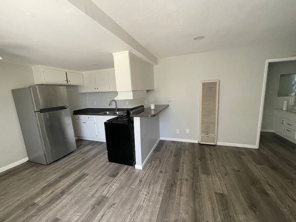Kitchen and living room feature recessed lighting