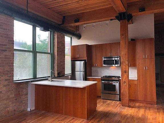 Kitchen as seen from the living space, unfurnished.
