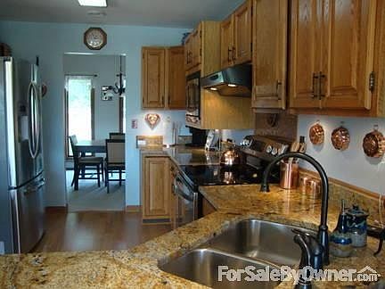 Newly remodeled kitchen
						:
						Granite countertops and stainless steel appliances