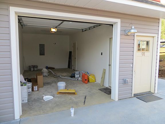 The garage and front door for the apartment.