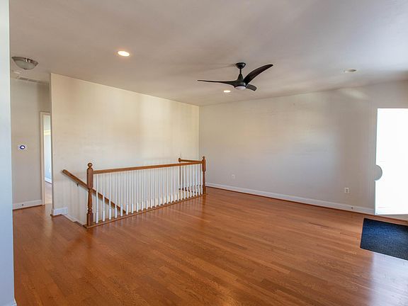 Massive living room. Good lighting. Access to rooftop deck, and spiral staircase.