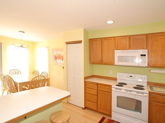 Looking at part of the kitchen and the dining room. 