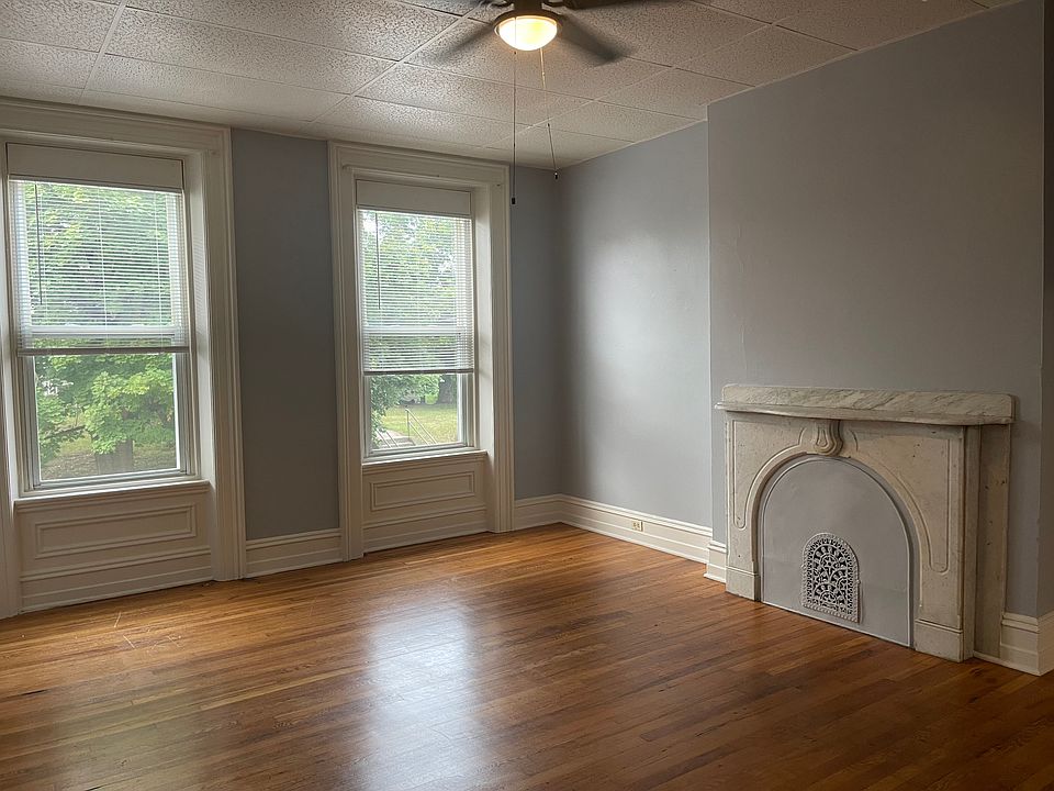 Living room front entry door to the left side of picture