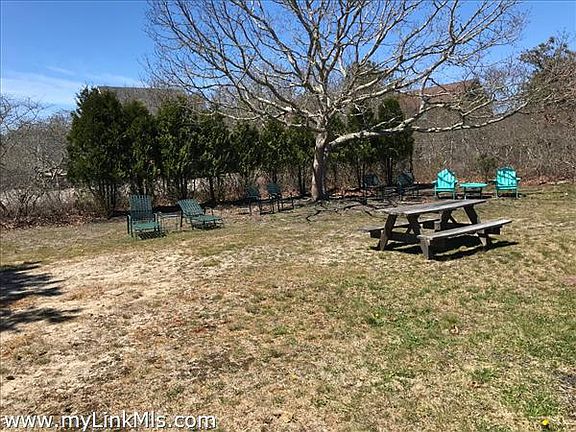 Back yard has outside deck and shower