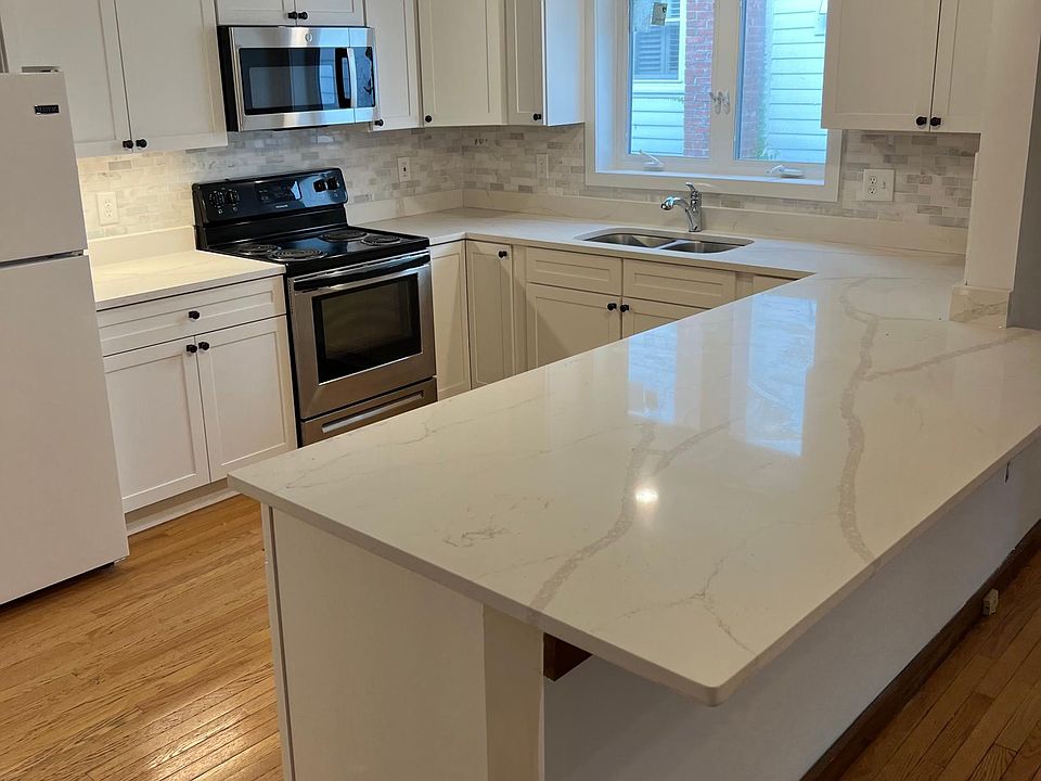 Brand new kitchen with granite countertops and new Shake-style cabinets. 
Windows for views and light.