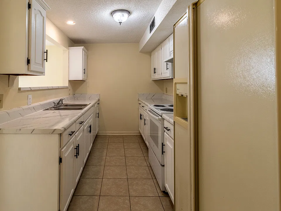 Full Kitchen With Fridge From Hallway View