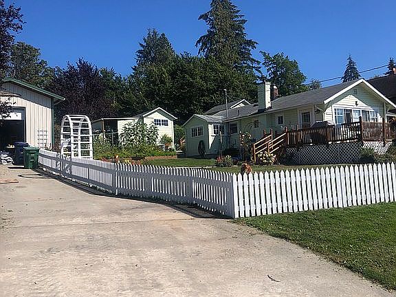 White picket fence and Arbor