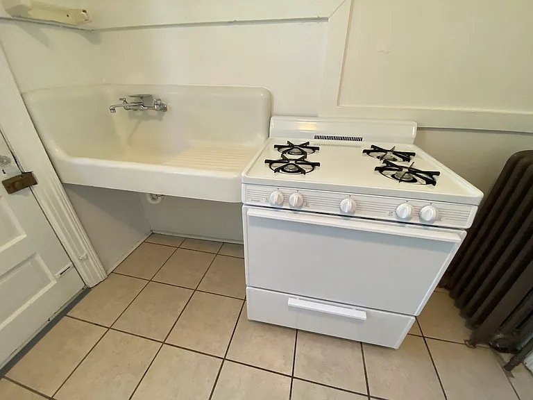 We have a gas range oven next to the historic iron sink. Gas, water, sewage, and trash are all included in the rental cost.