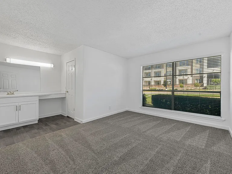 Spacious bedroom or office space with built in storage