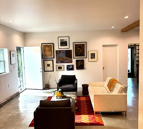 Living rooms view from dining room, one step up