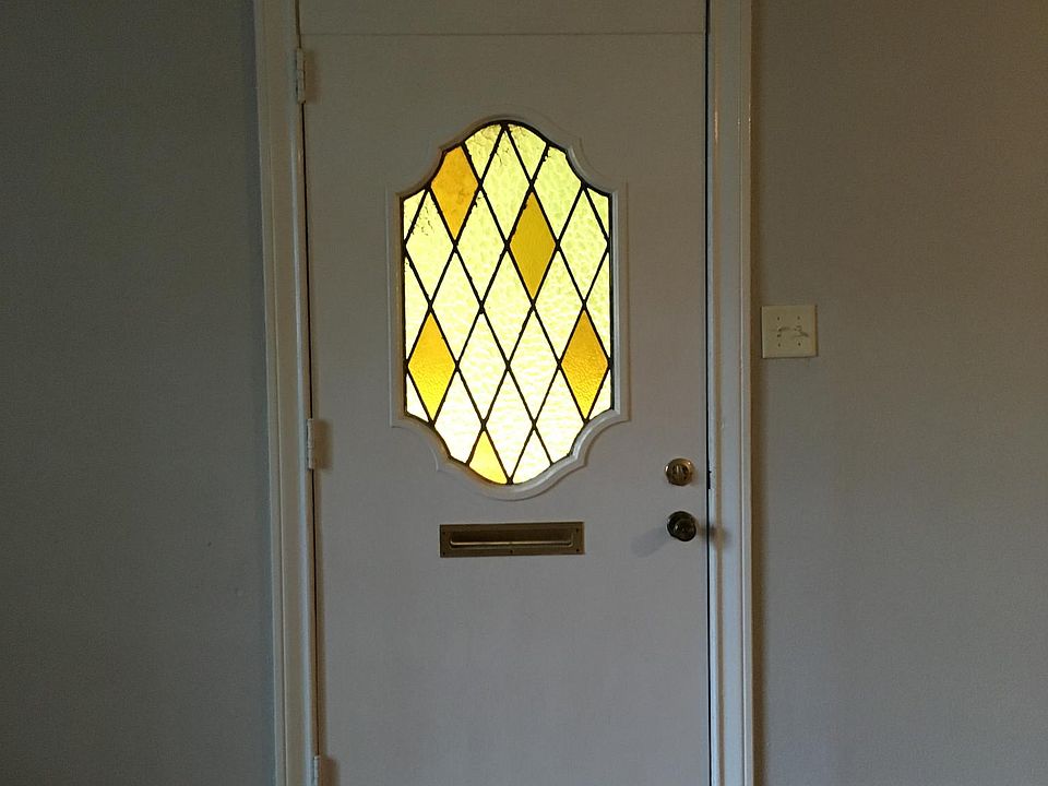 Front door with mail slot.