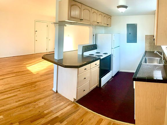 Open kitchen gives apartment an expansive, modern feel.